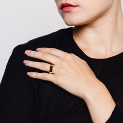 A woman wearing a Wide Point Ring