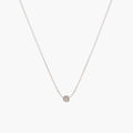 Simple silver dot necklace by Matthew Calvin on a white background