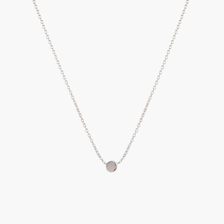 Simple silver dot necklace by Matthew Calvin on a white background