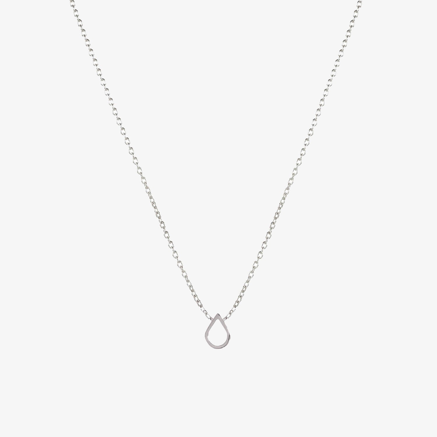 A silver necklace with a teardrop shaped charm on a white background