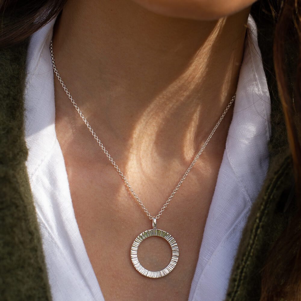 Close up of a model wearing Matthew Calvin Doru Circle Necklace