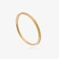 Gold textured ring on a white background