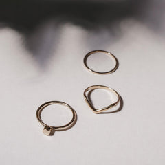 Close up of a group of rings on a white background