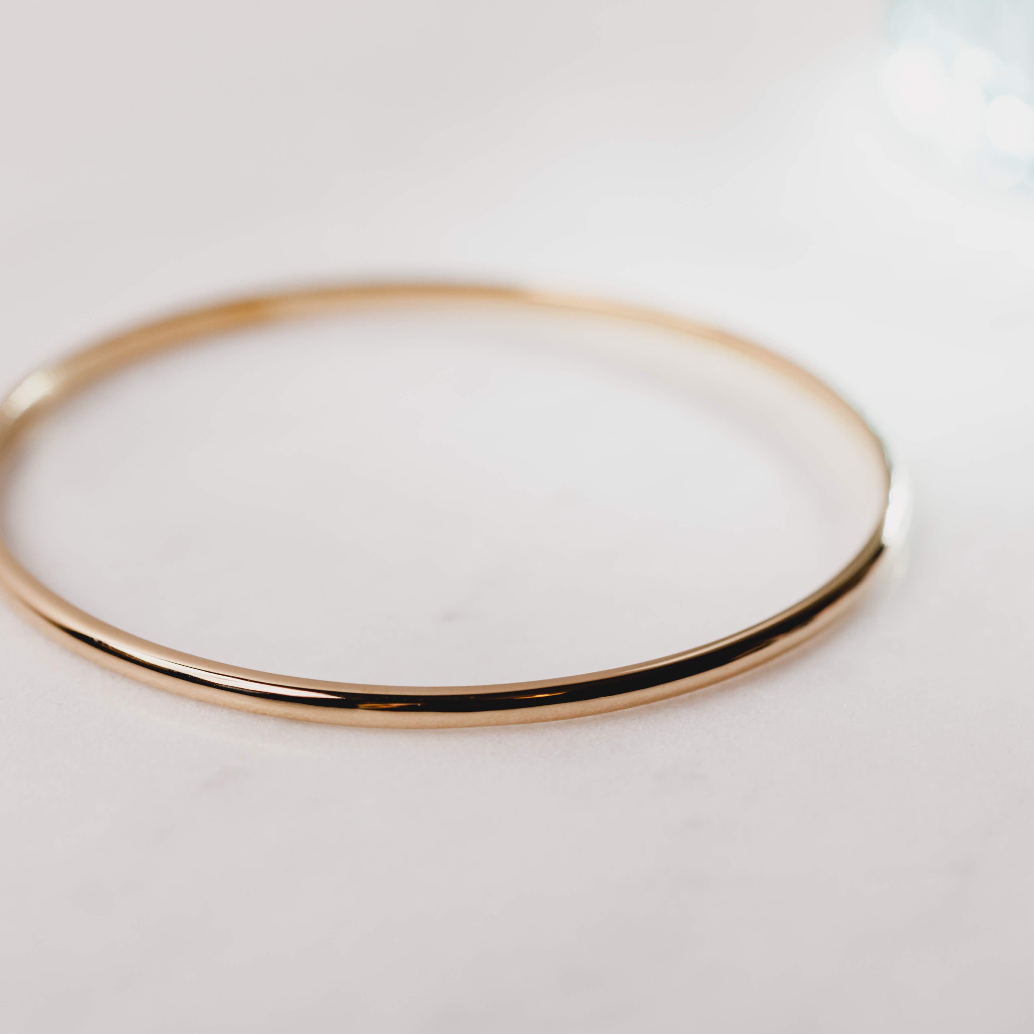 Close up of a rose gold bangle