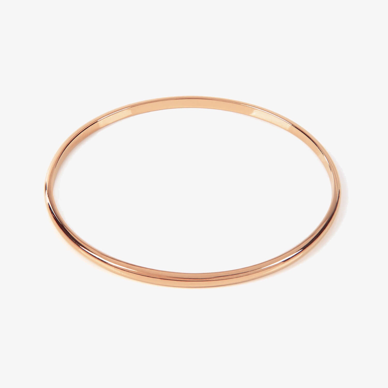 Plain rose gold bangle on a white background