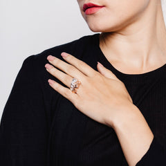 Woman wearing two rings in different colours with texture