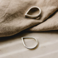 Two silver rings, one Point Ring and one Wide Point Ring