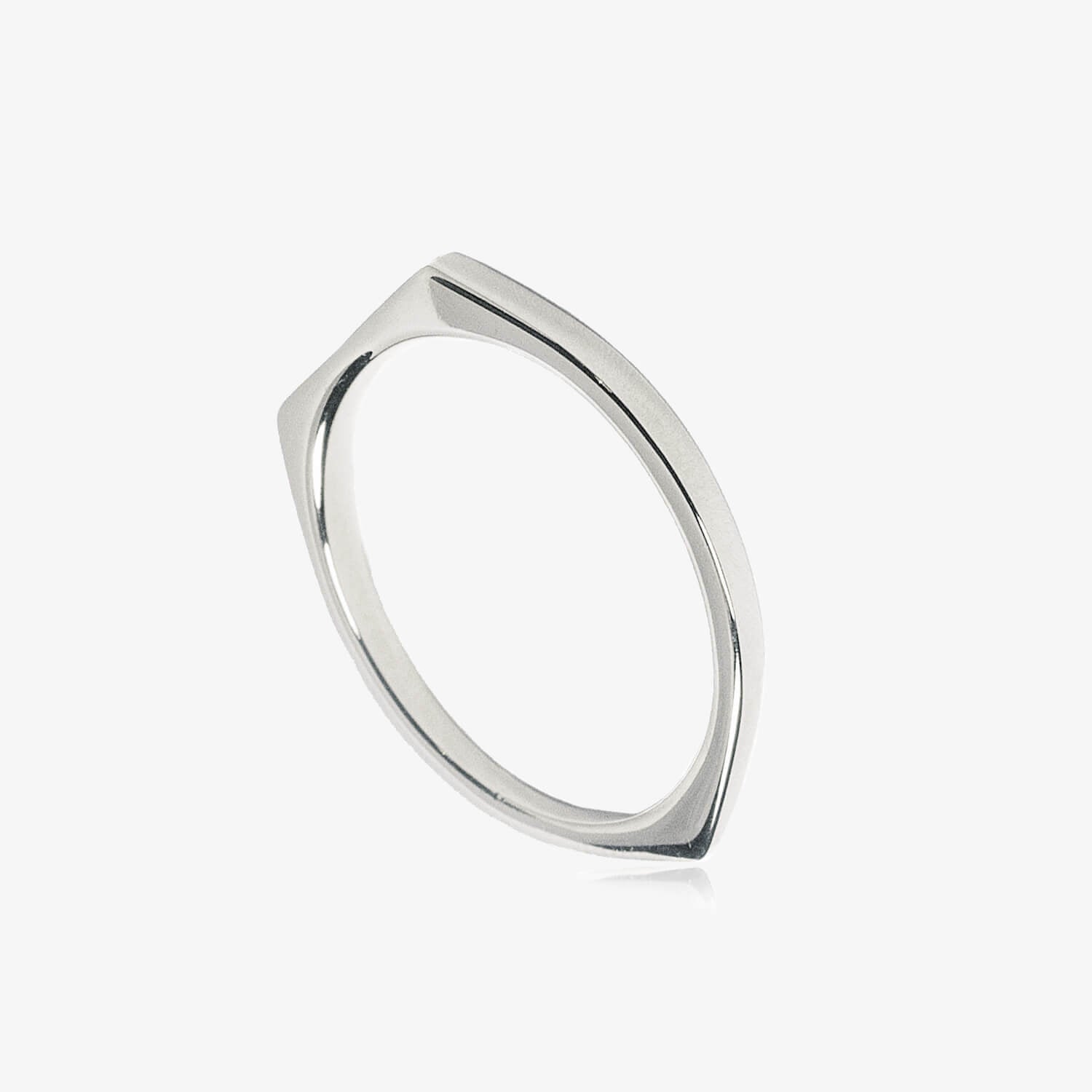 A thin silver signet ring tapering to a point at the bottom