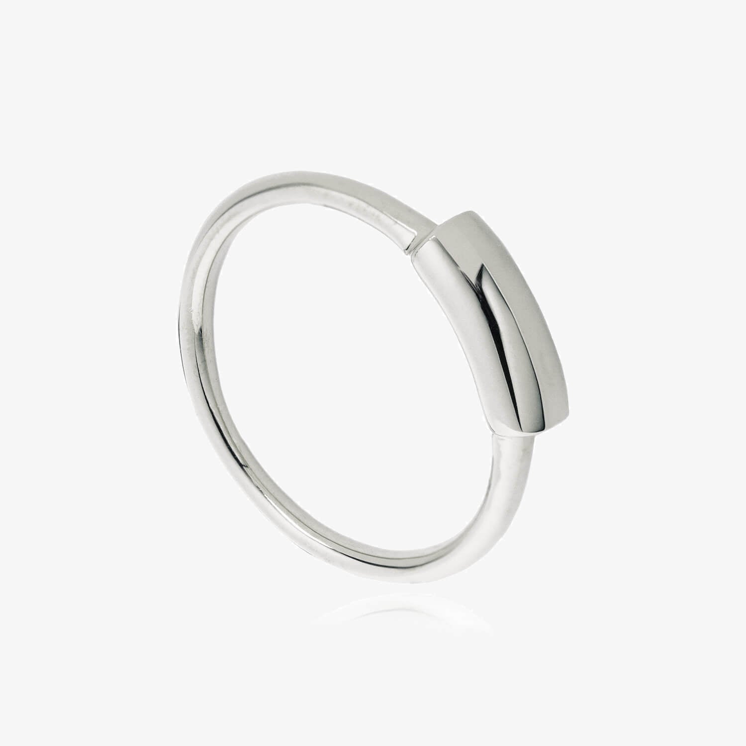 Close up of silver ring with thick wire signet detail on a white background