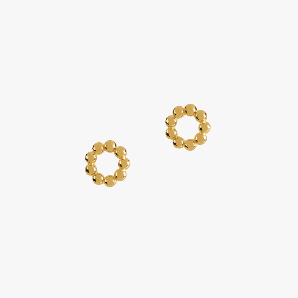 gold vermeil beaded circular studs by matthew calvin on a white background