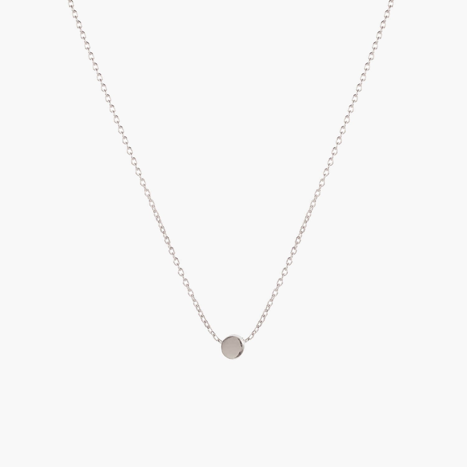 Simple silver dot necklace by Matthew Calvin on a white background