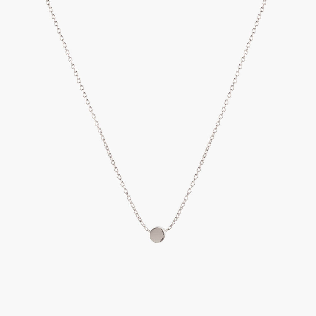 Simple silver dot necklace by Matthew Calvin on a white background