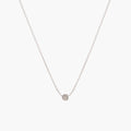 Simple silver dot necklace by Matthew Calvin on a white background