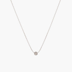 Simple silver dot necklace by Matthew Calvin on a white background