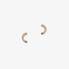 matthew calvin rose gold crescent shaped earrings on a white background