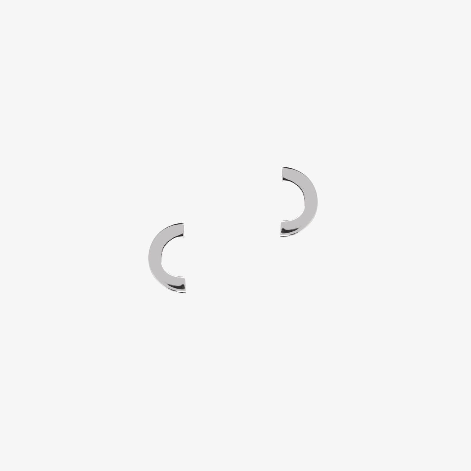 matthew calvin silver crescent shaped earrings on a white background
