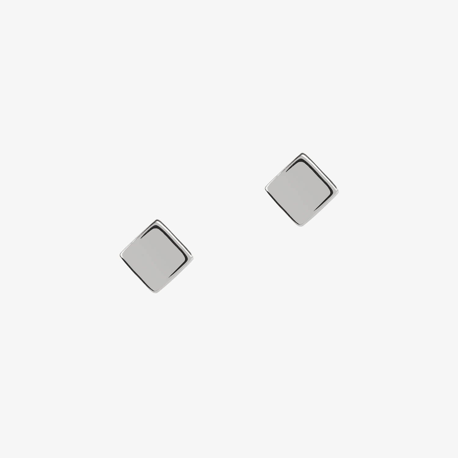 silver cube square stud earrings by matthew calvin on a white background