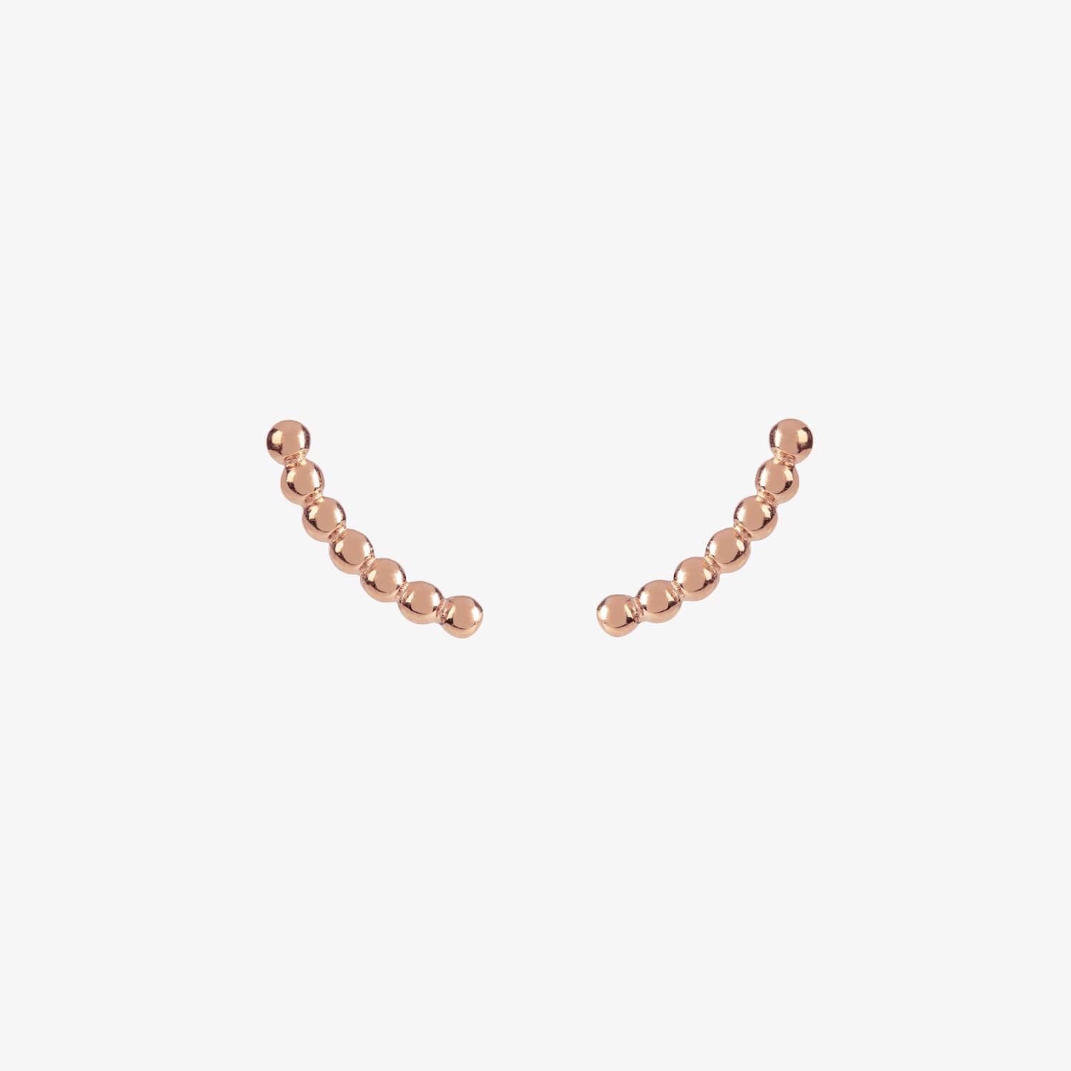 rose gold curved beaded ear climber stud earrings by matthew calvin on a white background