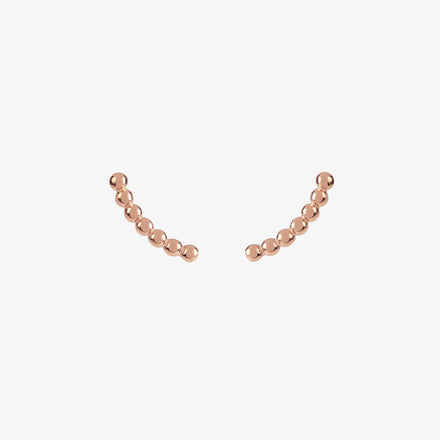 rose gold curved beaded ear climber stud earrings by matthew calvin on a white background