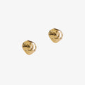 small gold nugget dappled stud earrings by matthew calvin on a white background