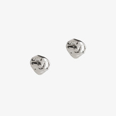 small silver nugget dappled stud earrings by matthew calvin on a white background