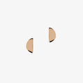 Rose gold disc shaped earrings on a white background