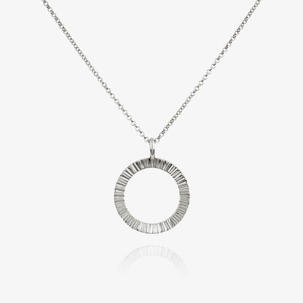 A silver Matthew Calvin necklace with a belcher chain