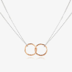 Silver chain with rose gold intertwined rings