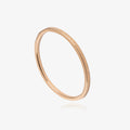 Rose gold textured ring on a white background