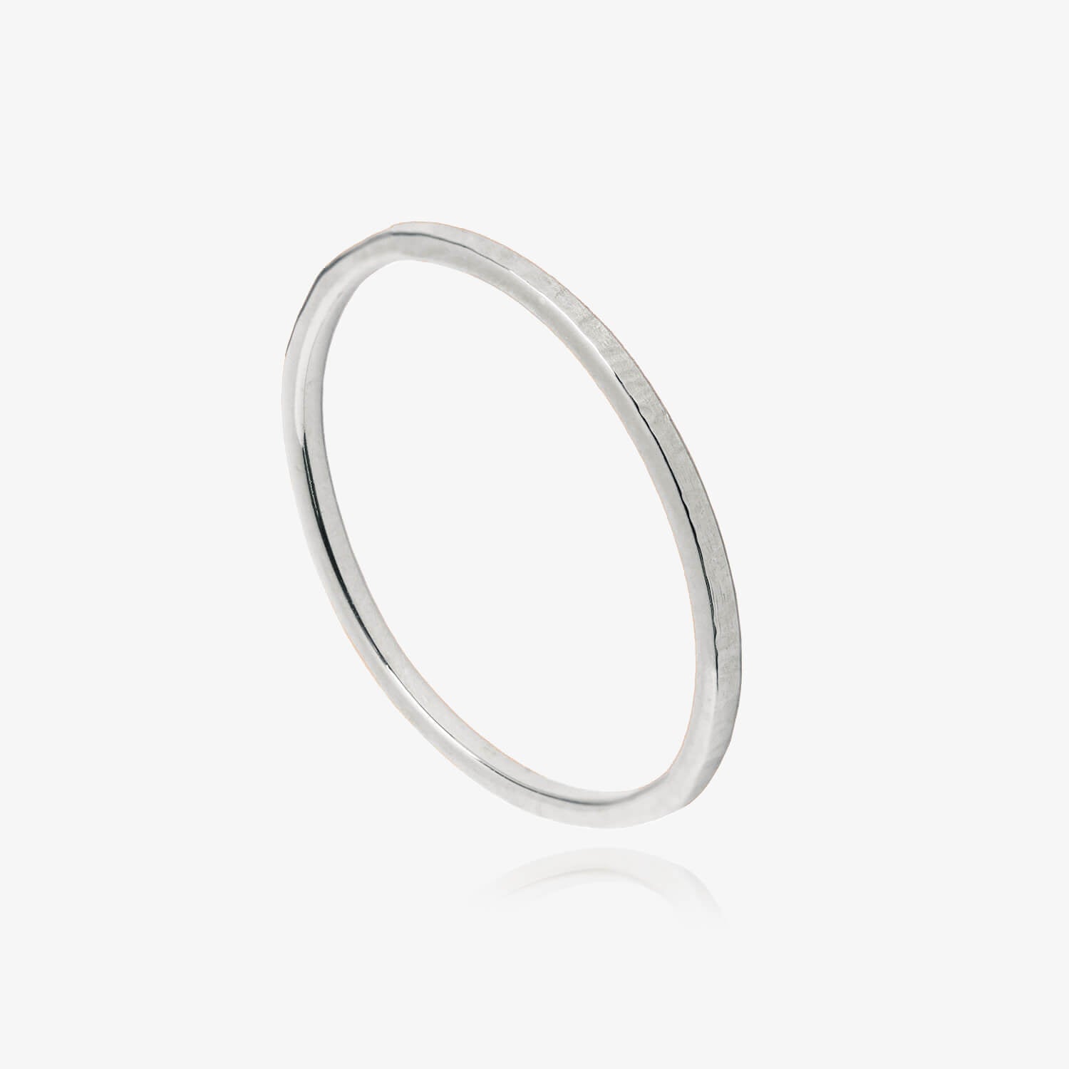 Textured silver ring on a white background