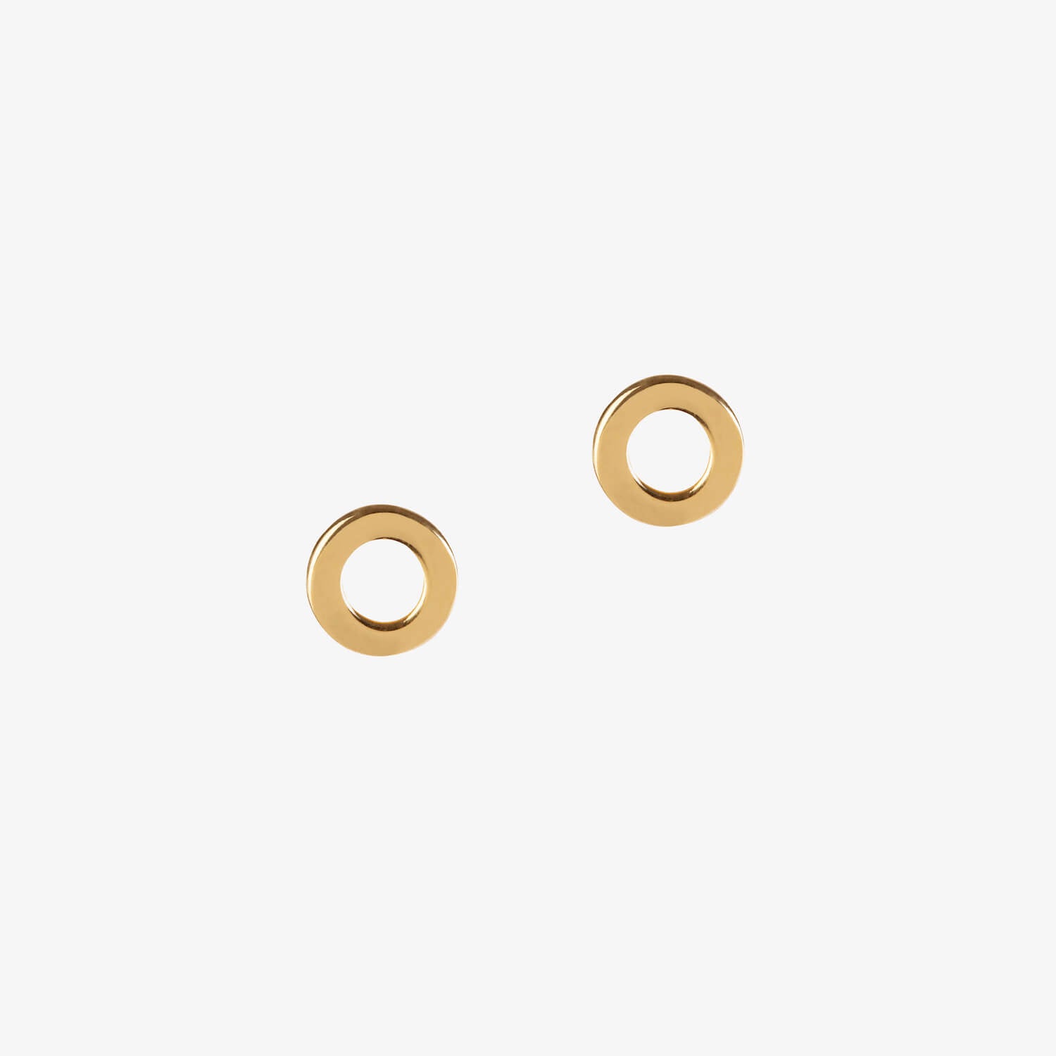 gold loop circle stud earrings by matthew calvin on a white background