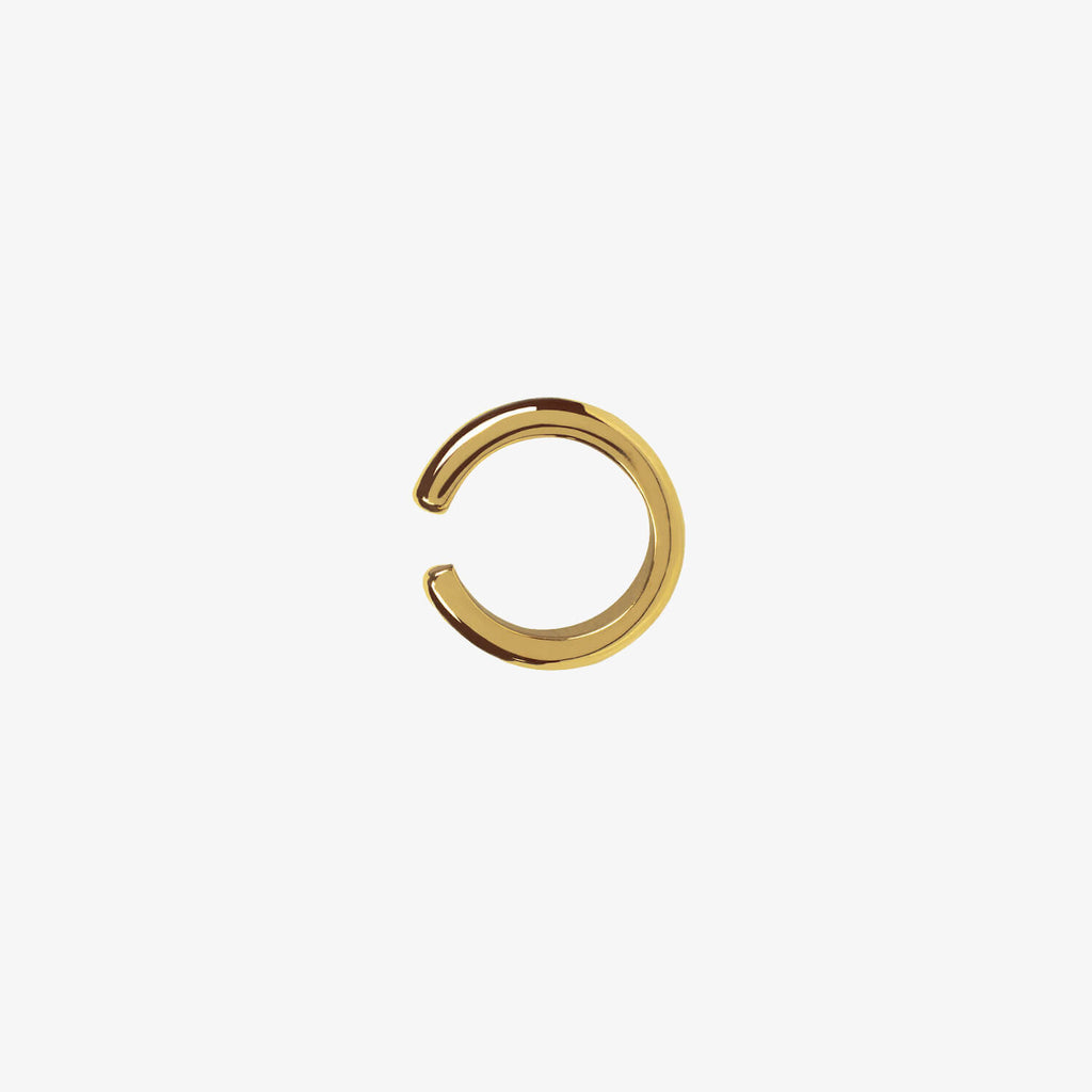 Small gold open ear cuff on a white background