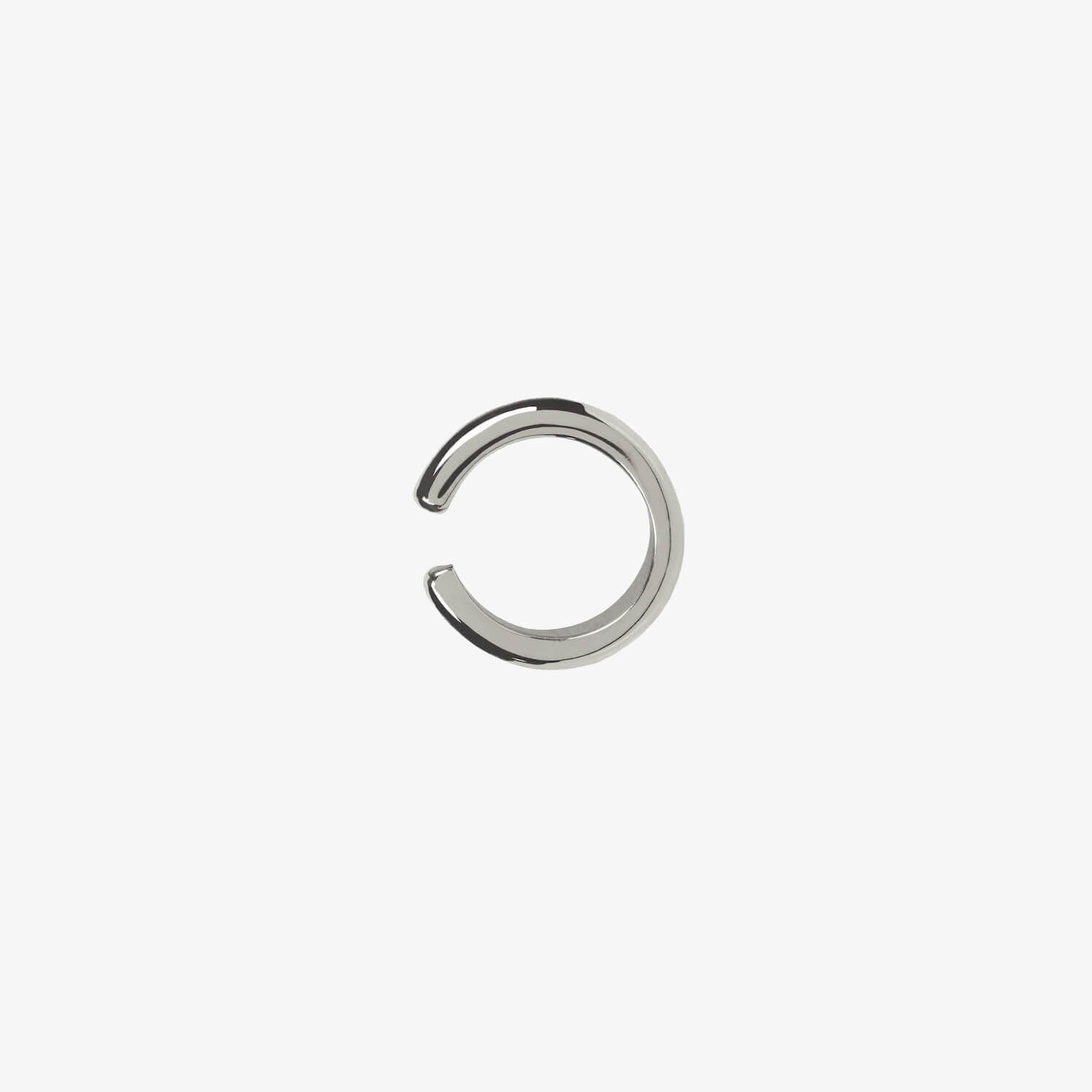 Small silver open ear cuff on white background