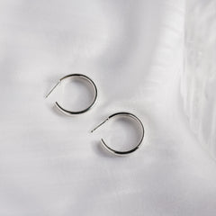 Silver plain hoops on a white background
