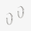 Large plain silver hoops on a white background