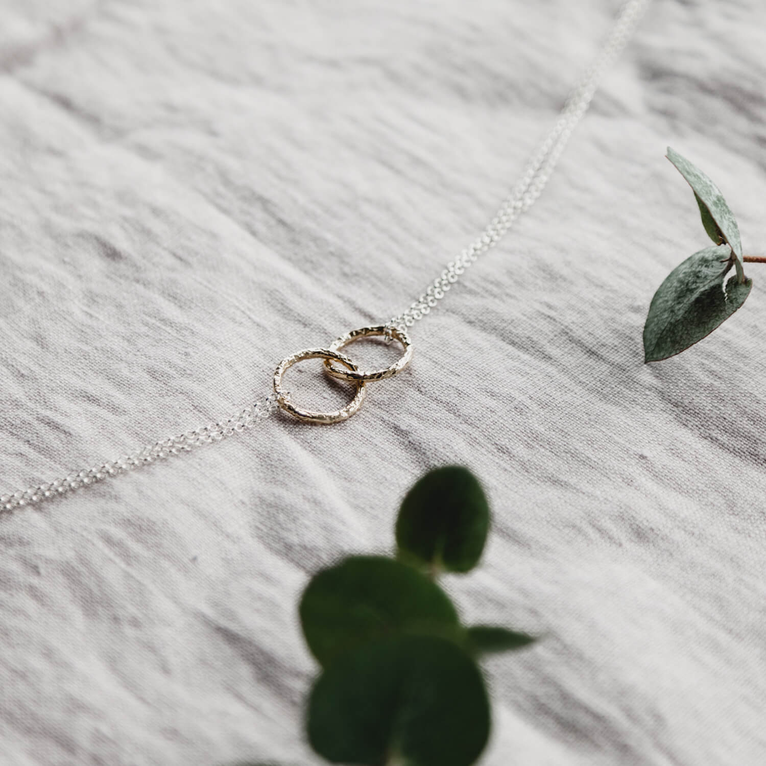 Close up of Double Meteorite Ring Necklace in rose gold