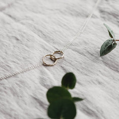 Close up of Double Meteorite Ring Necklace in rose gold