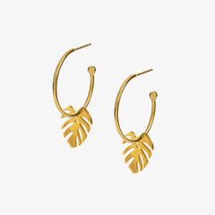 Medium sized gold hoops with gold monstera leaf charms