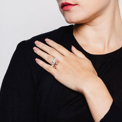 Model wearing two textured rings, one in silver and one in rose gold