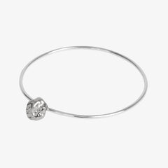 Solid sterling silver bangle with meteorite style charm