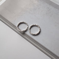 Two silver rings with textured detailing by Matthew Calvin Jewellery
