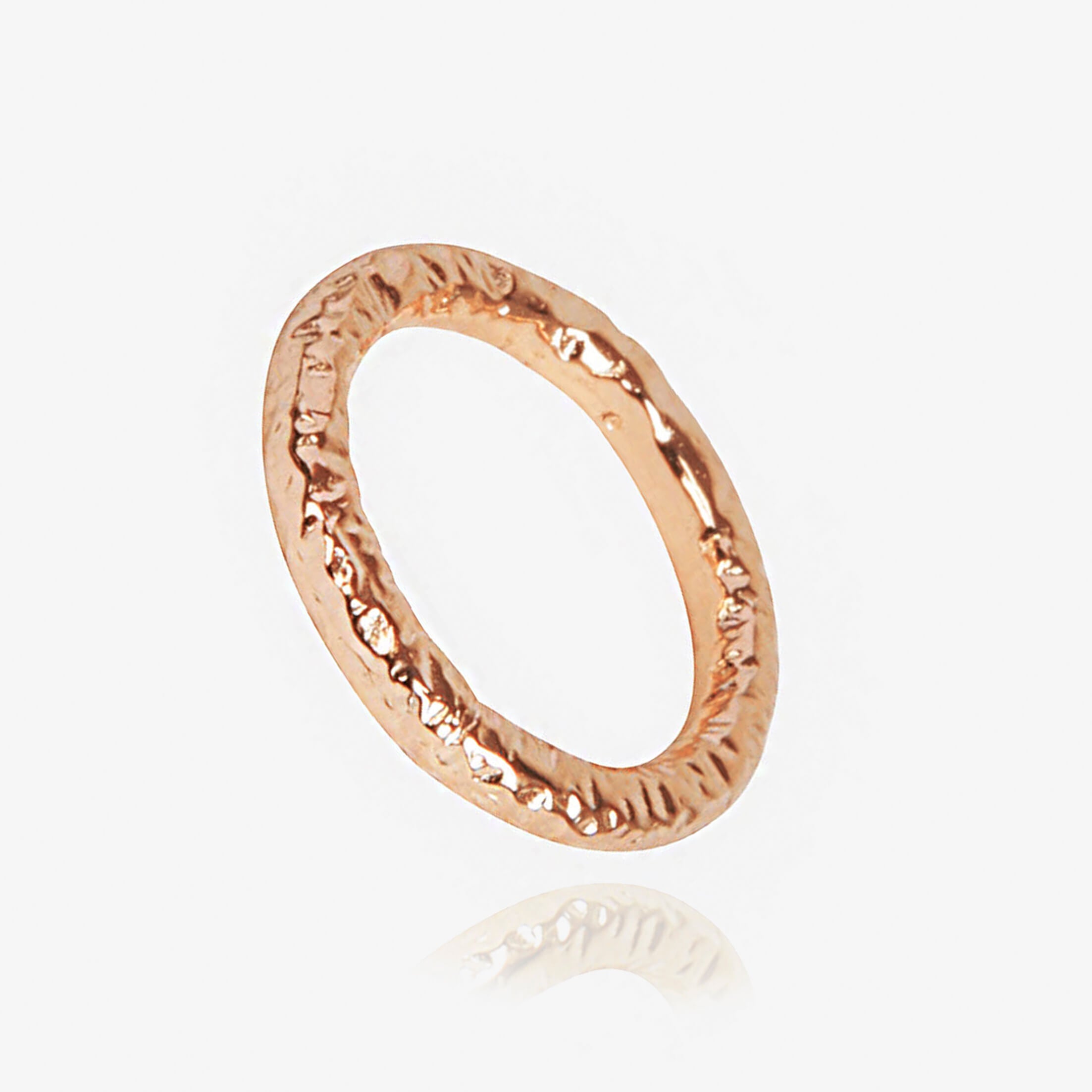 Hand-textured ring in rose gold by Matthew Calvin