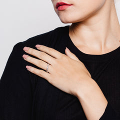 Close up of model wearing ring with meteorite style texturing in silver