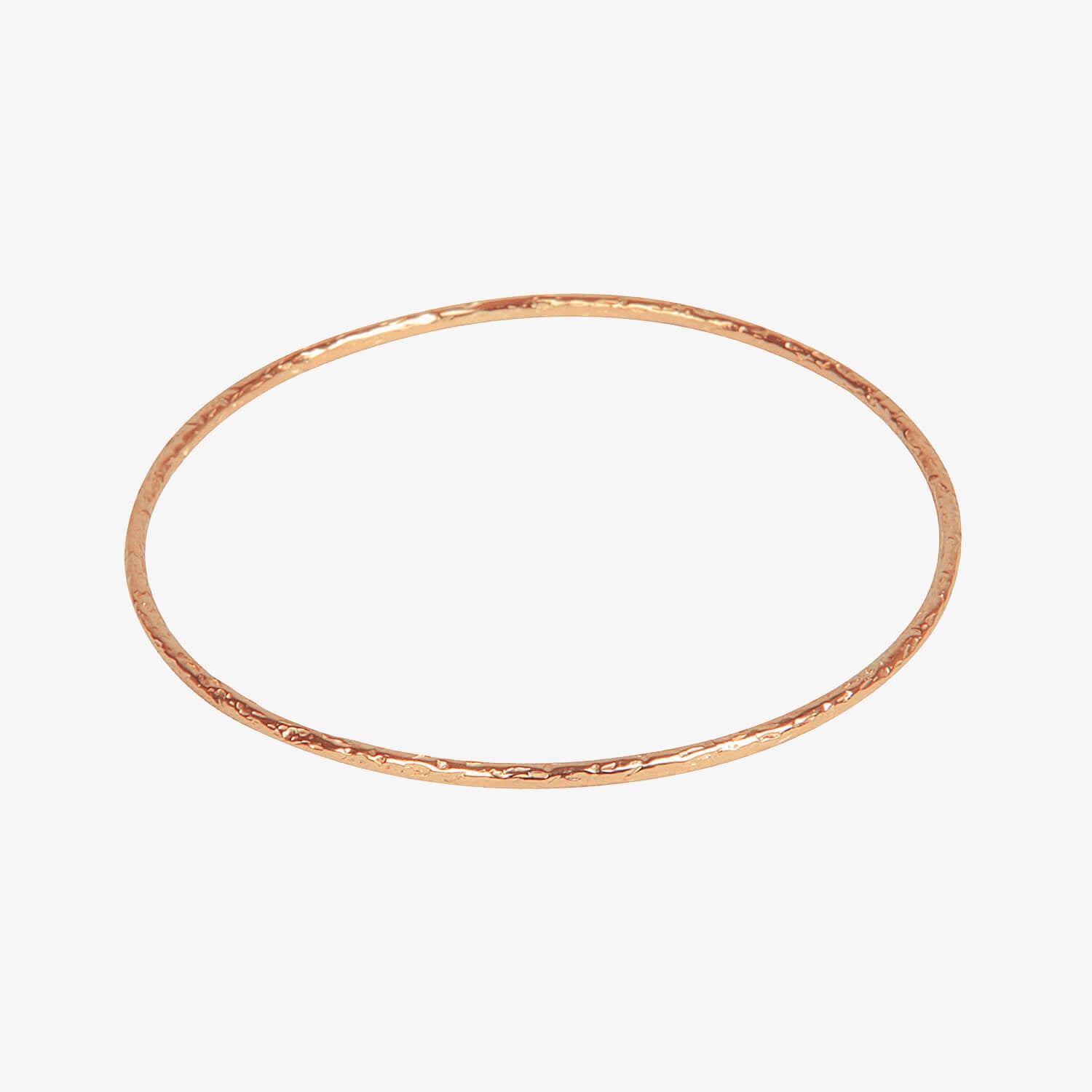 Thin rose gold bangle with meteorite style rough texturing