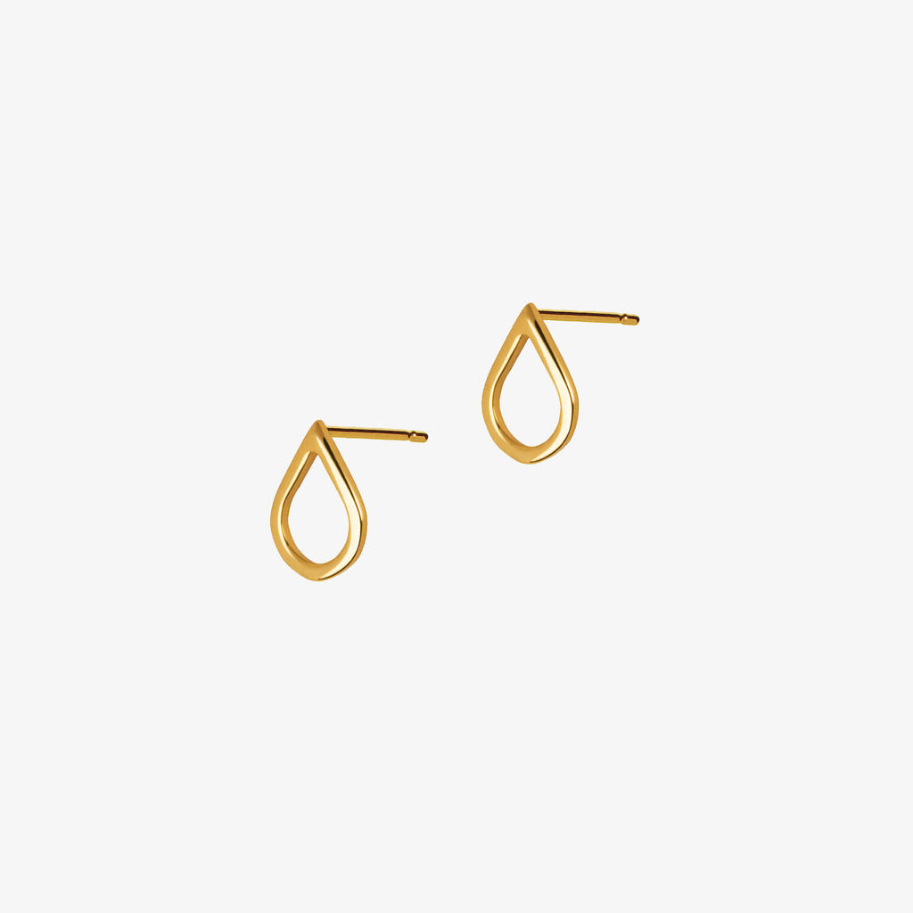Gold teardrop shaped earrings on a white background