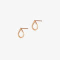 Close up of rose gold droplet shaped earrings on a white background