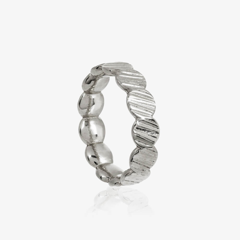 Close up of sterling silver Charm Ring by Matthew Calvin