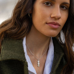 Model wearing silver Trio necklace with belcher chain