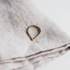 Close up of a Point Ring on a rough cloth background