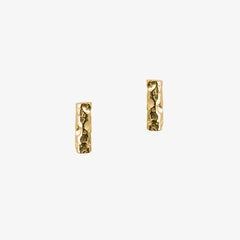 Small bar earrings with a meteorite style textured finish in gold